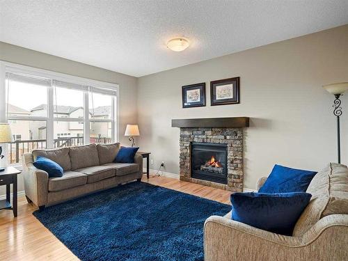 12 Sage Bank Road Nw, Calgary, AB - Indoor Photo Showing Living Room With Fireplace