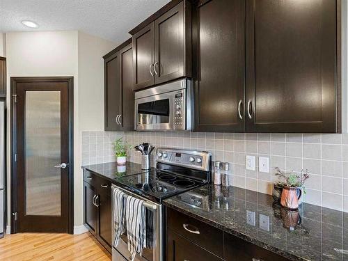 12 Sage Bank Road Nw, Calgary, AB - Indoor Photo Showing Kitchen With Upgraded Kitchen