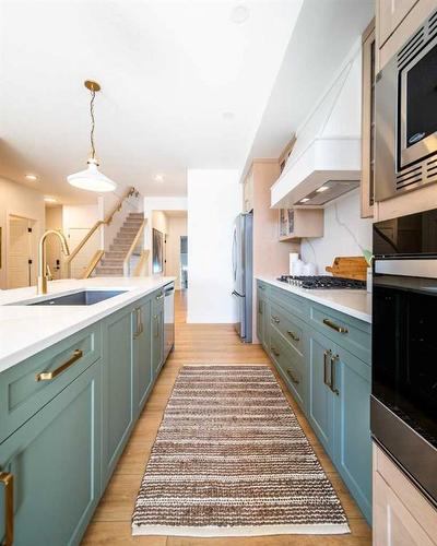 927 Langholm Drive Se, Airdrie, AB - Indoor Photo Showing Kitchen