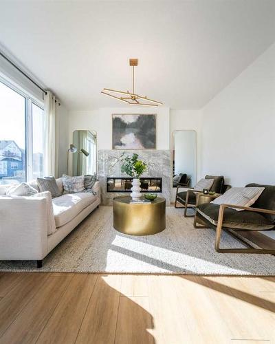 927 Langholm Drive Se, Airdrie, AB - Indoor Photo Showing Living Room