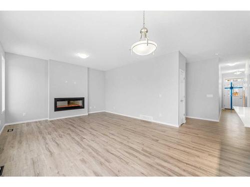 11 Cityline Manor Ne, Calgary, AB - Indoor Photo Showing Living Room With Fireplace