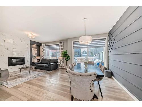 136 Creekstone Square Sw, Calgary, AB - Indoor Photo Showing Living Room With Fireplace