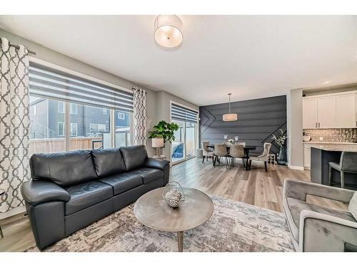 136 Creekstone Square Sw, Calgary, AB - Indoor Photo Showing Living Room With Fireplace