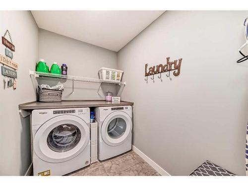 136 Creekstone Square Sw, Calgary, AB - Indoor Photo Showing Laundry Room