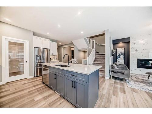 136 Creekstone Square Sw, Calgary, AB - Indoor Photo Showing Other Room With Fireplace