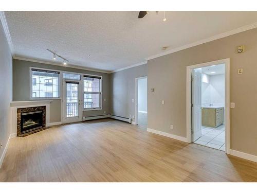 208-495 78 Avenue Sw, Calgary, AB - Indoor With Fireplace