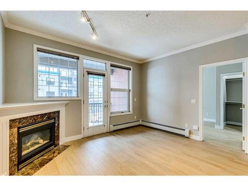 208-495 78 Avenue Sw, Calgary, AB - Indoor With Fireplace