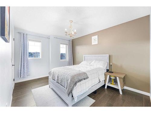 108 West Pointe Manor, Cochrane, AB - Indoor Photo Showing Bedroom