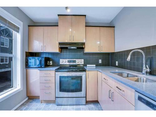 326 Toscana Gardens Nw, Calgary, AB - Indoor Photo Showing Kitchen With Double Sink