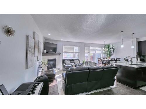 127 Evanswood Circle Nw, Calgary, AB - Indoor Photo Showing Living Room With Fireplace