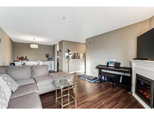 3204-Tuscarora Tuscarora Manor Nw, Calgary, AB - Indoor Photo Showing Living Room With Fireplace