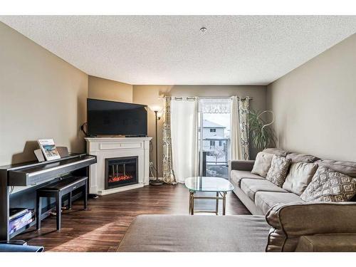 3204-Tuscarora Tuscarora Manor Nw, Calgary, AB - Indoor Photo Showing Living Room With Fireplace