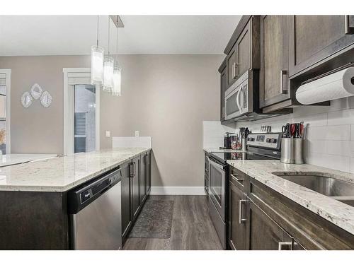 44 Covecreek Mews Ne, Calgary, AB - Indoor Photo Showing Kitchen With Upgraded Kitchen