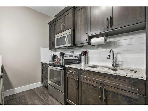 44 Covecreek Mews Ne, Calgary, AB - Indoor Photo Showing Kitchen With Double Sink