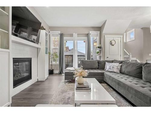 44 Covecreek Mews Ne, Calgary, AB - Indoor Photo Showing Living Room With Fireplace