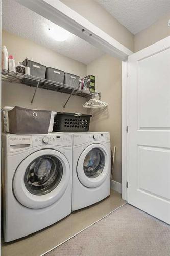 44 Covecreek Mews Ne, Calgary, AB - Indoor Photo Showing Laundry Room