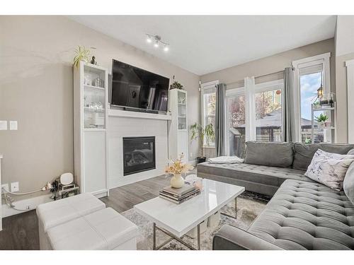 44 Covecreek Mews Ne, Calgary, AB - Indoor Photo Showing Living Room With Fireplace