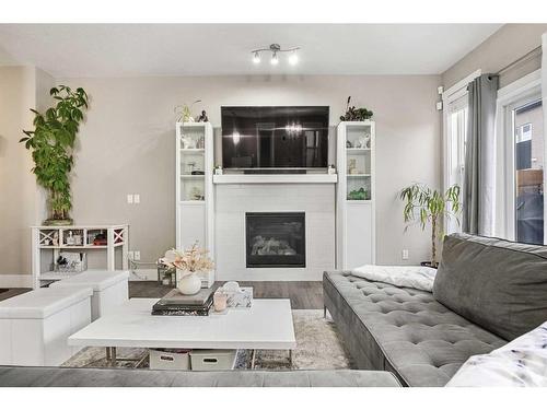 44 Covecreek Mews Ne, Calgary, AB - Indoor Photo Showing Living Room With Fireplace