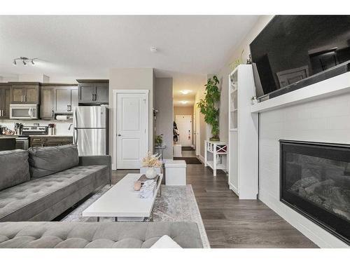 44 Covecreek Mews Ne, Calgary, AB - Indoor Photo Showing Living Room With Fireplace