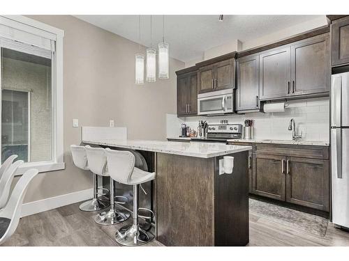 44 Covecreek Mews Ne, Calgary, AB - Indoor Photo Showing Kitchen With Upgraded Kitchen