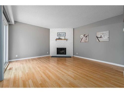 12-287 Southampton Drive Sw, Calgary, AB - Indoor Photo Showing Living Room With Fireplace