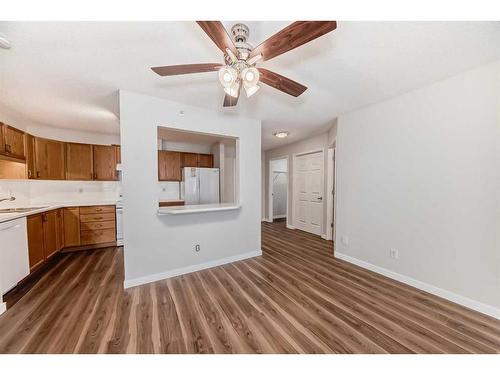 1313-928 Arbour Lake Road Nw, Calgary, AB - Indoor Photo Showing Kitchen