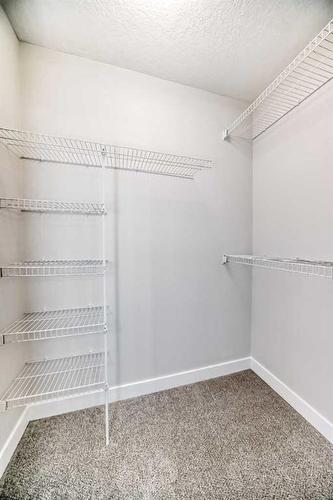 1180 Kings Heights Road Se, Airdrie, AB - Indoor With Storage