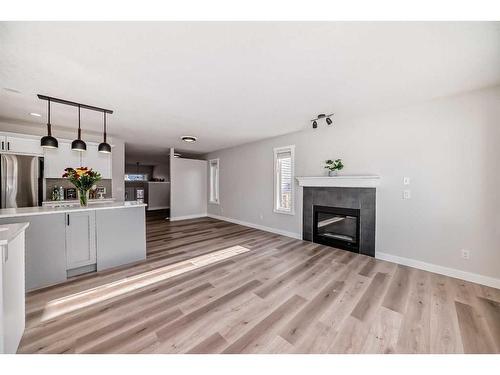 1180 Kings Heights Road Se, Airdrie, AB - Indoor Photo Showing Living Room With Fireplace