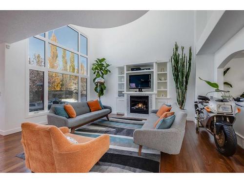 110 Cougarstone Terrace Sw, Calgary, AB - Indoor Photo Showing Living Room With Fireplace