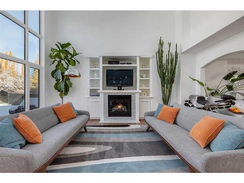 110 Cougarstone Terrace Sw, Calgary, AB - Indoor Photo Showing Living Room With Fireplace