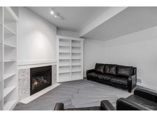 110 Cougarstone Terrace Sw, Calgary, AB - Indoor Photo Showing Living Room With Fireplace