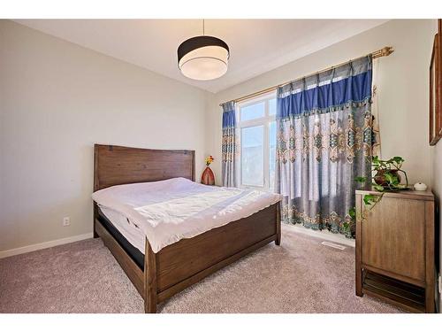 565 Marine Drive Se, Calgary, AB - Indoor Photo Showing Bedroom