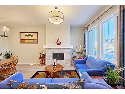 565 Marine Drive Se, Calgary, AB - Indoor Photo Showing Living Room With Fireplace