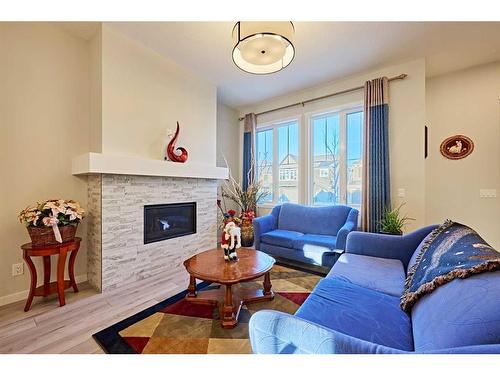 565 Marine Drive Se, Calgary, AB - Indoor Photo Showing Living Room With Fireplace