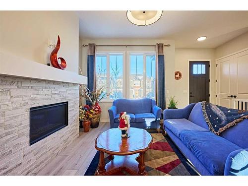 565 Marine Drive Se, Calgary, AB - Indoor Photo Showing Living Room With Fireplace