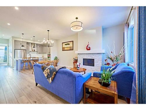 565 Marine Drive Se, Calgary, AB - Indoor Photo Showing Living Room With Fireplace