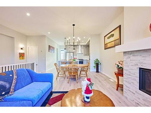 565 Marine Drive Se, Calgary, AB - Indoor Photo Showing Living Room With Fireplace