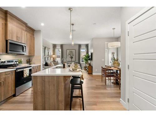 133 Ambleside Heath Nw, Calgary, AB - Indoor Photo Showing Kitchen With Upgraded Kitchen