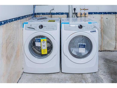 203 Falshire Way Ne, Calgary, AB - Indoor Photo Showing Laundry Room