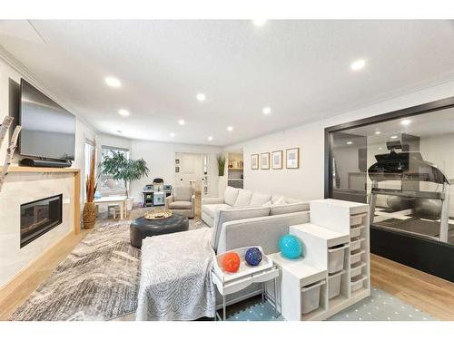 131 Canterbury Court Sw, Calgary, AB - Indoor Photo Showing Living Room With Fireplace