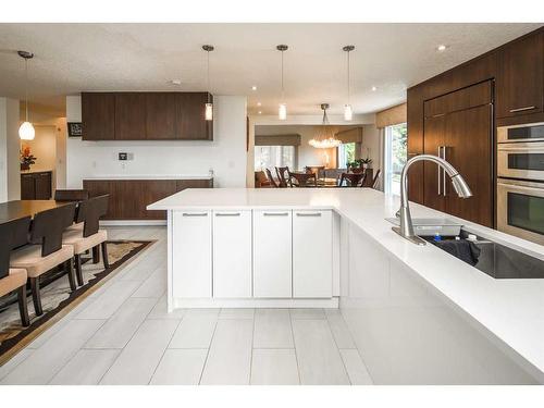 16 Silver Creek Place Nw, Calgary, AB - Indoor Photo Showing Kitchen With Double Sink With Upgraded Kitchen