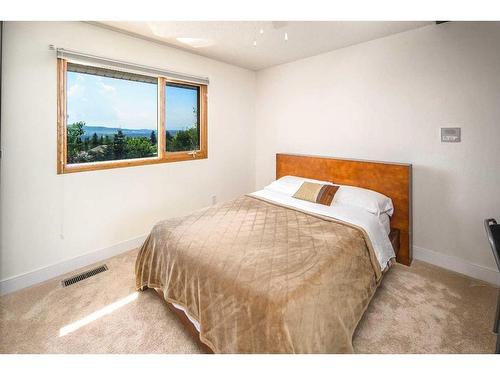 16 Silver Creek Place Nw, Calgary, AB - Indoor Photo Showing Bedroom