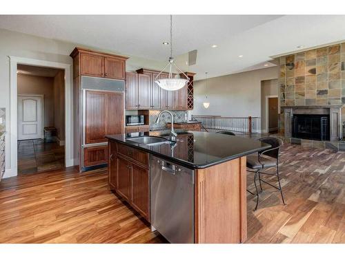 270009 Horse Creek Road, Rural Rocky View County, AB - Indoor Photo Showing Kitchen With Fireplace With Double Sink