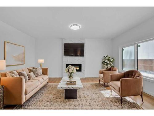 525 Corner Meadows Way Ne, Calgary, AB - Indoor Photo Showing Living Room With Fireplace