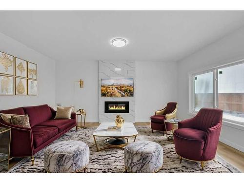 525 Corner Meadows Way Ne, Calgary, AB - Indoor Photo Showing Living Room With Fireplace