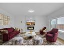 525 Corner Meadows Way Ne, Calgary, AB  - Indoor Photo Showing Living Room With Fireplace 