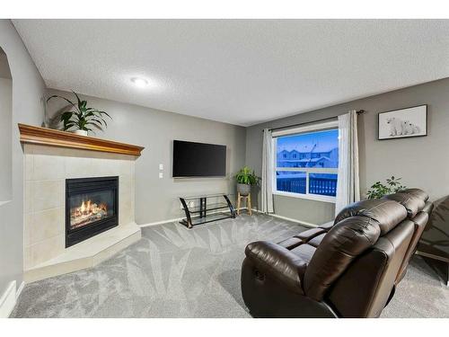 30 Royal Oak Grove Nw, Calgary, AB - Indoor Photo Showing Living Room With Fireplace