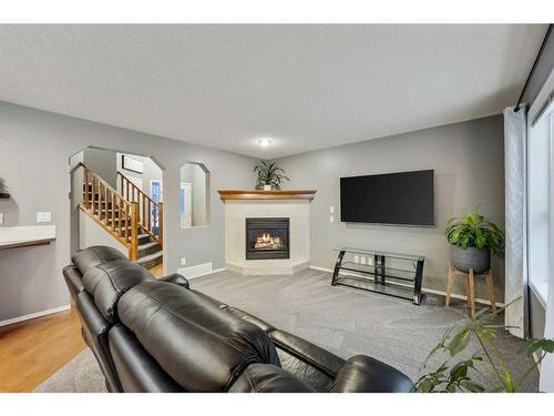 30 Royal Oak Grove Nw, Calgary, AB - Indoor Photo Showing Living Room With Fireplace