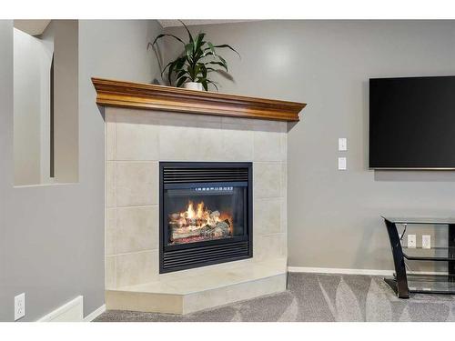 30 Royal Oak Grove Nw, Calgary, AB - Indoor Photo Showing Living Room With Fireplace