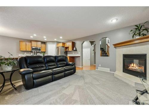 30 Royal Oak Grove Nw, Calgary, AB - Indoor Photo Showing Living Room With Fireplace